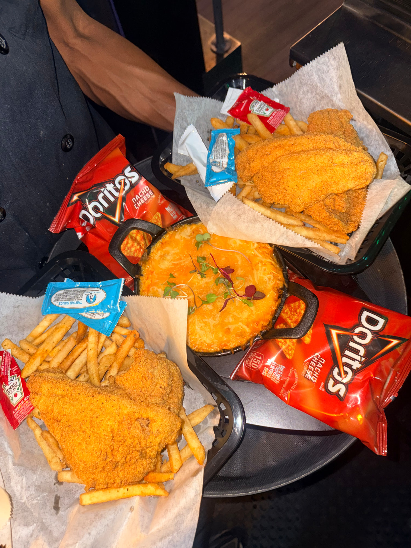 Fried fish baskets with seasoned fries and baked mac and cheese at Olivia 91
