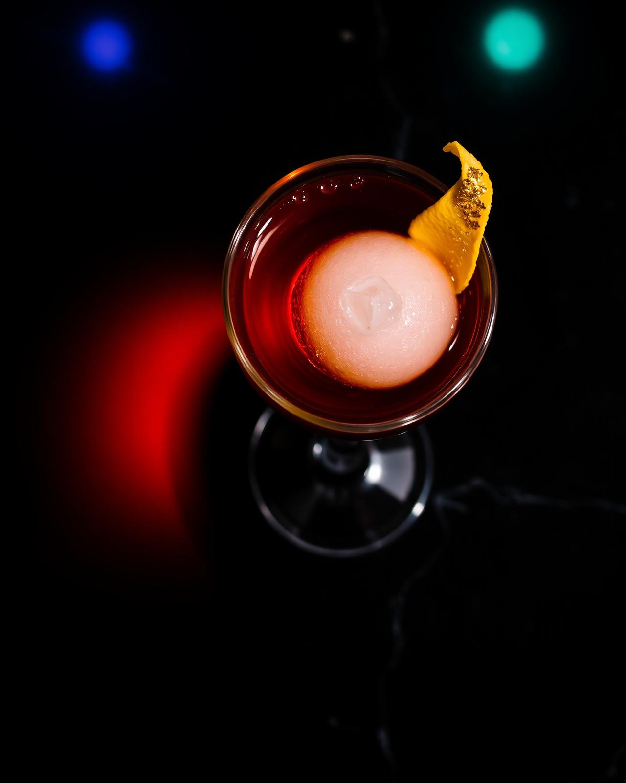 Signature cocktail in a coupe glass
